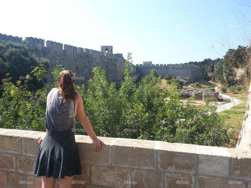 ginger in front of the castle. my girlfriend took a short break at our sight seeing tour in Rhodes and I caught the moment on my camera