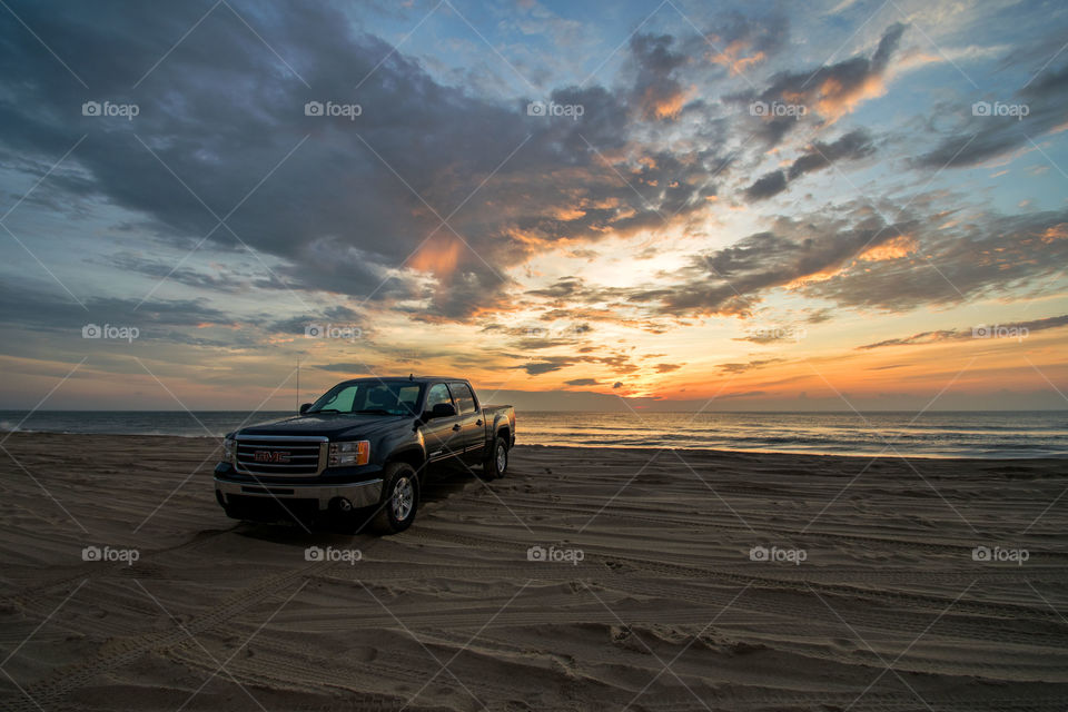 Stopping to take in a beautiful sunrise while driving down the 4x4 beach in Corolla, North Carolina.