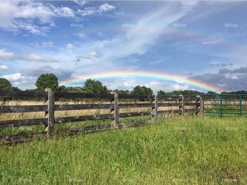 I had to pull over to get this picture once I seen this perfect rainbow. The fact that there just happened to be this cool fence there was a bonus!