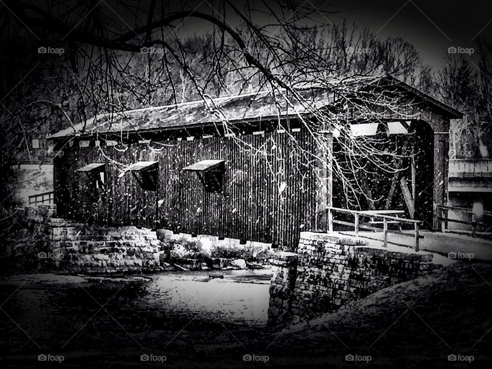 Covered bridge in black and white. 