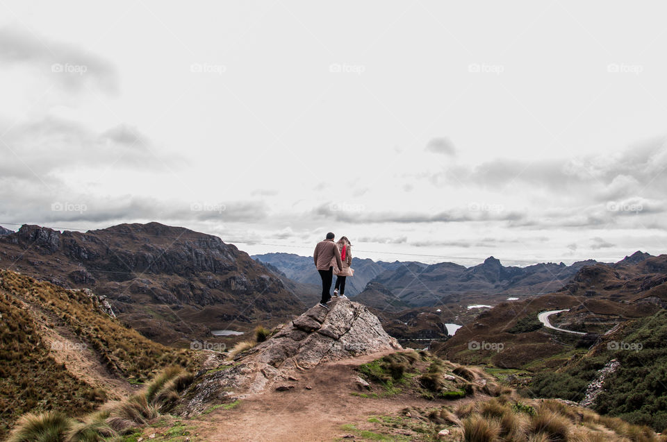 Young couple hiking in the mountains 