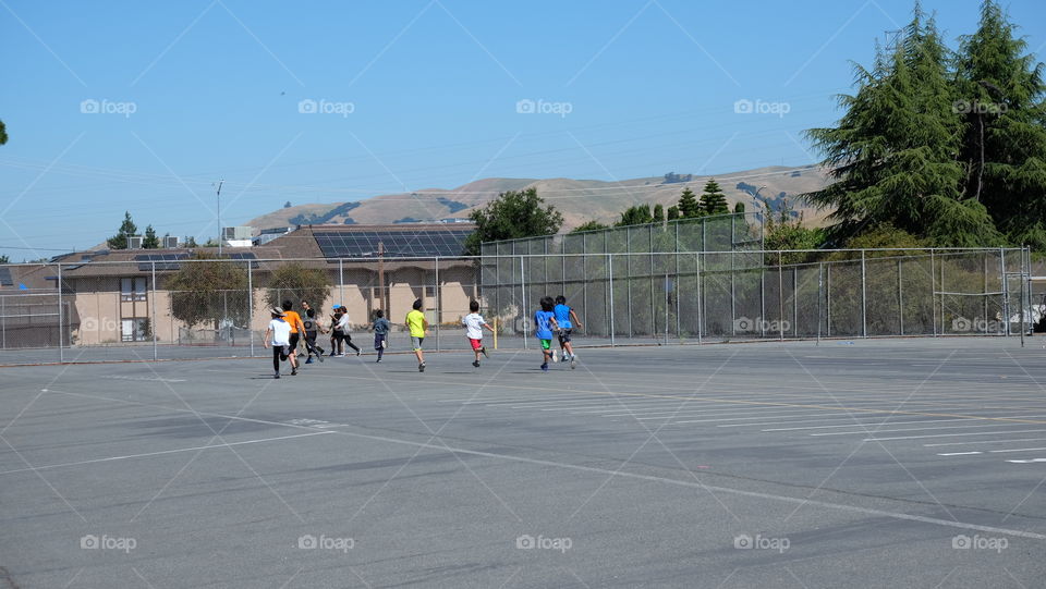 Kids running in the sun