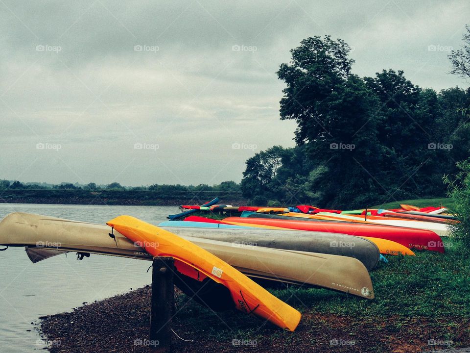 canoes docked lakeside