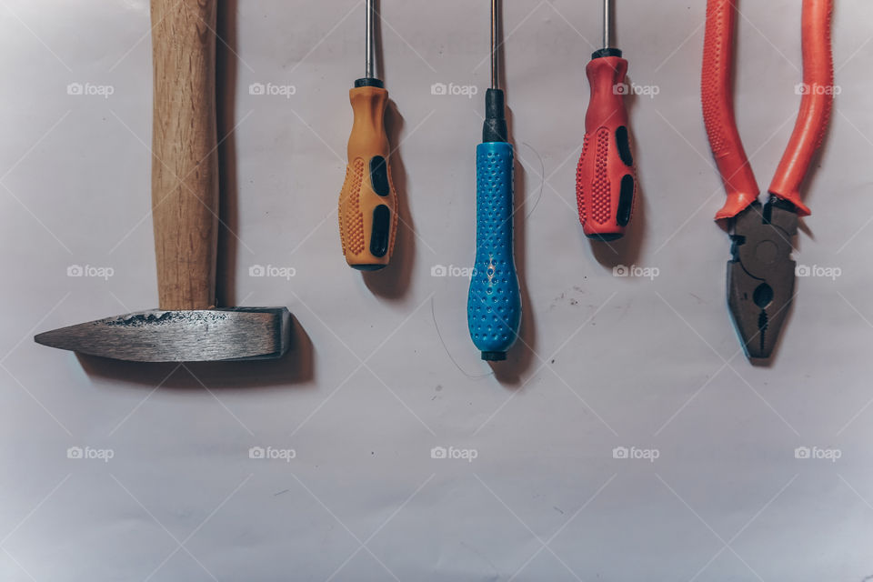 Set of equipment, consist of screwdrivers, hammer, and pliers.