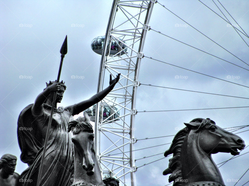 Statue and London Eye. Statue with view of London Eye. Old and new. 