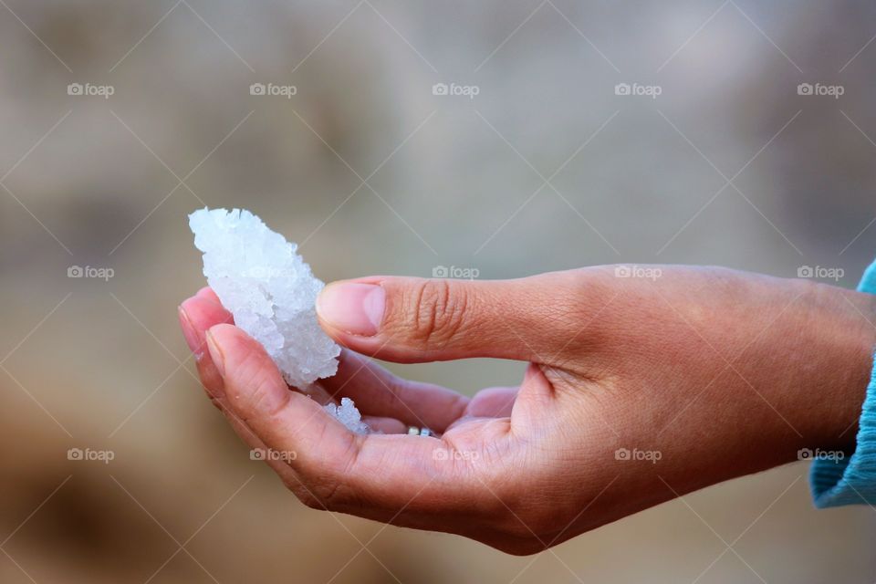 A child holding salt in the hand