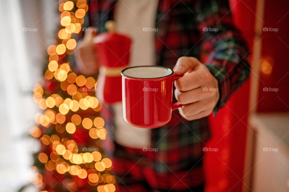 cup of coffee in a cozy festive Christmas atmosphere