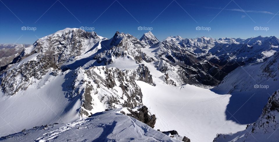 Scenic view of mountains covered with snow