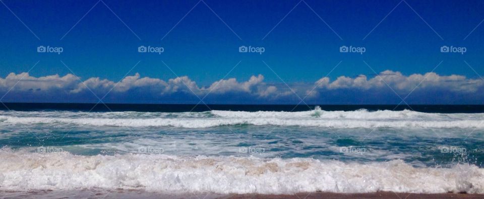 Sea and georgeous infinite blue sky.