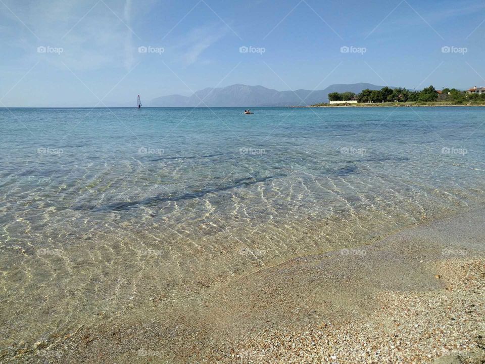 Distant view of boat at sea, Greece
