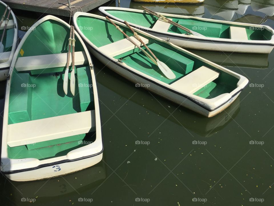 Green canoe on the water