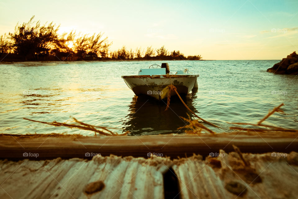 Boat moored at lake