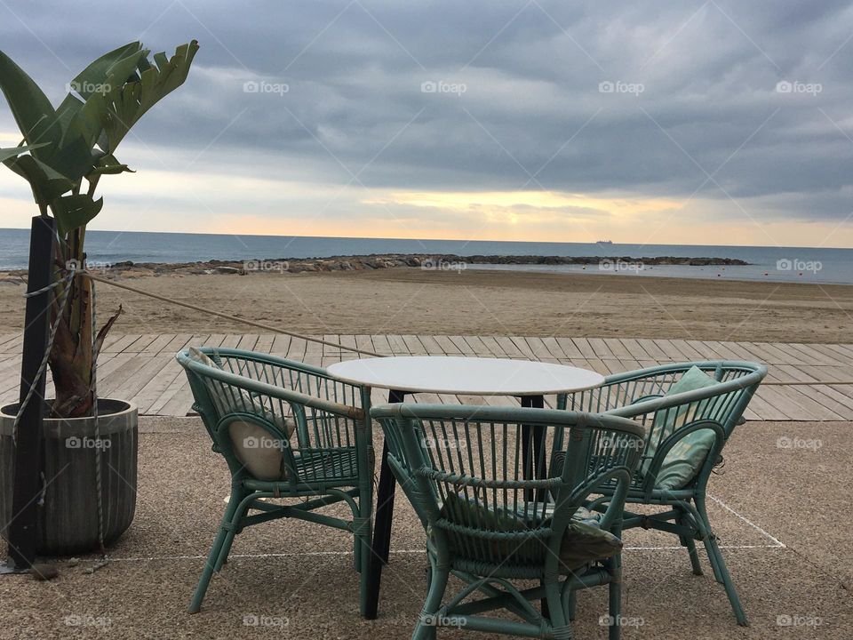 Inviting table with seashore view