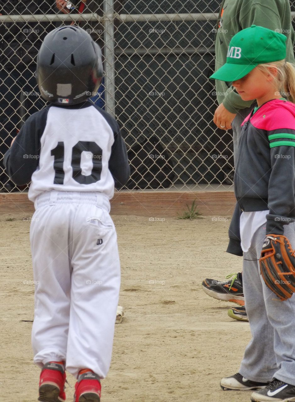 Young Baseball Players. Young Boy And Girl Playing Baseball
