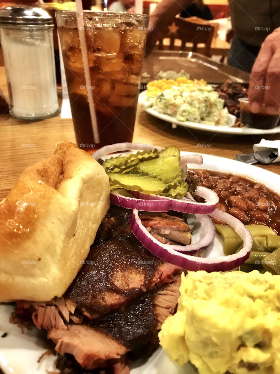 Texas BBQ brisket and ribs along with potato salad, baked beans and fresh dinner rolls!