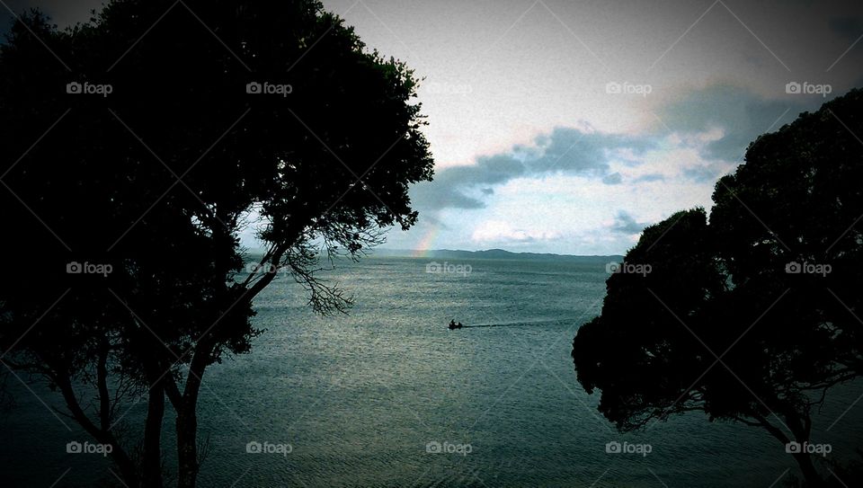 Rainbow over the pacific ocean