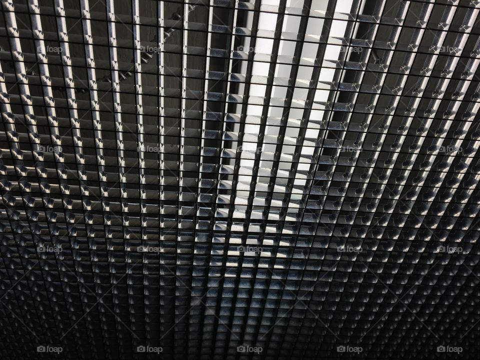 Chrome metallic fluorescent light fixture in elevator