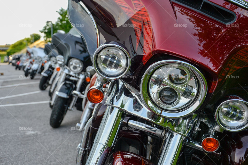 a large collection of motorcycles parked outside a hotel in Denmark.