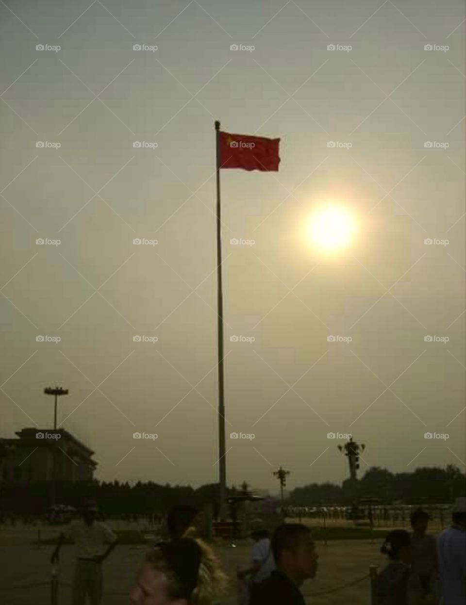 Smoggy skies and Chinese flag over Tienanmen Square, Beijing, China