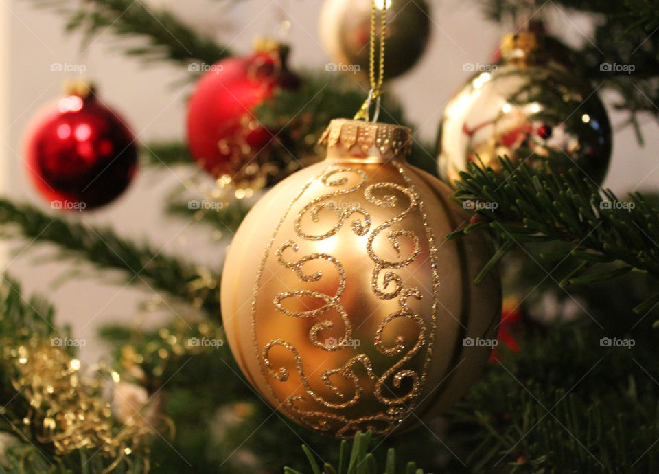 Golden and red christmas Balls on christmas tree close-up