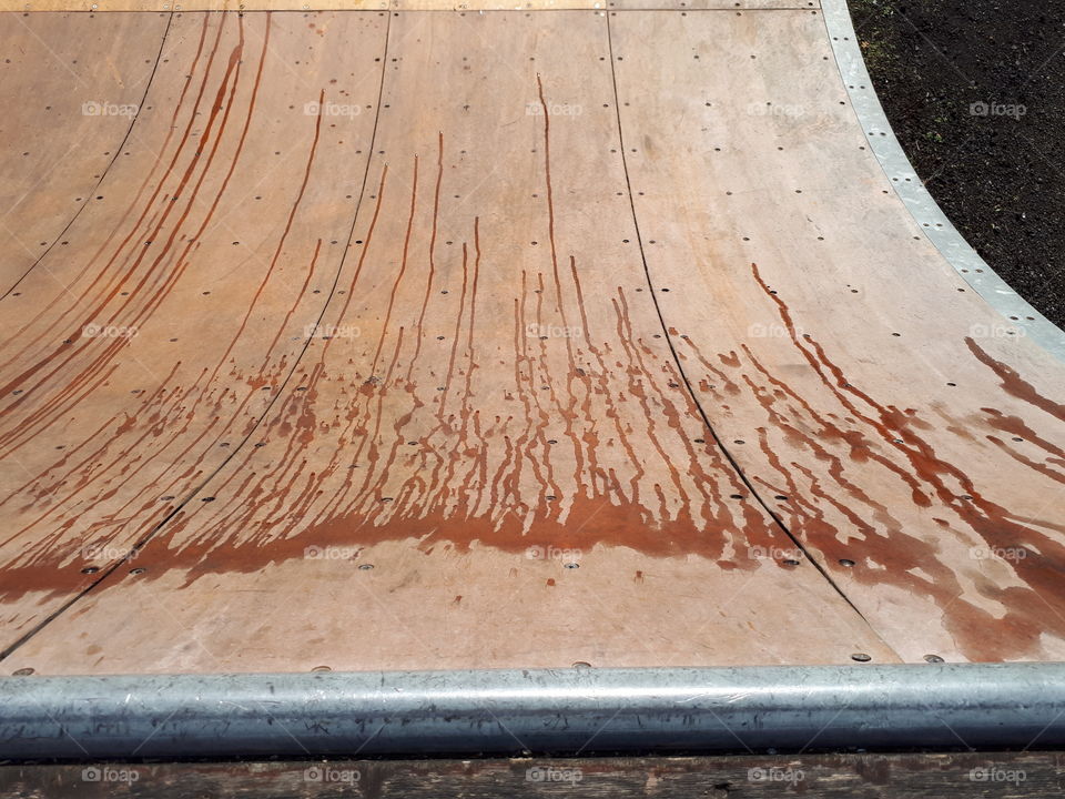 Water spilled on a skate park ramp