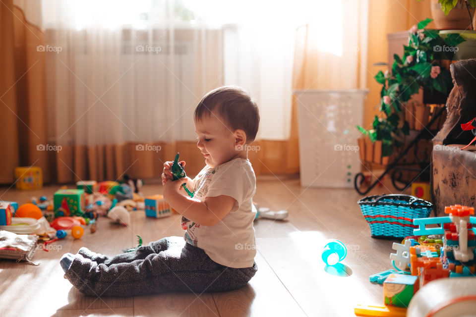  child plays toys at home
