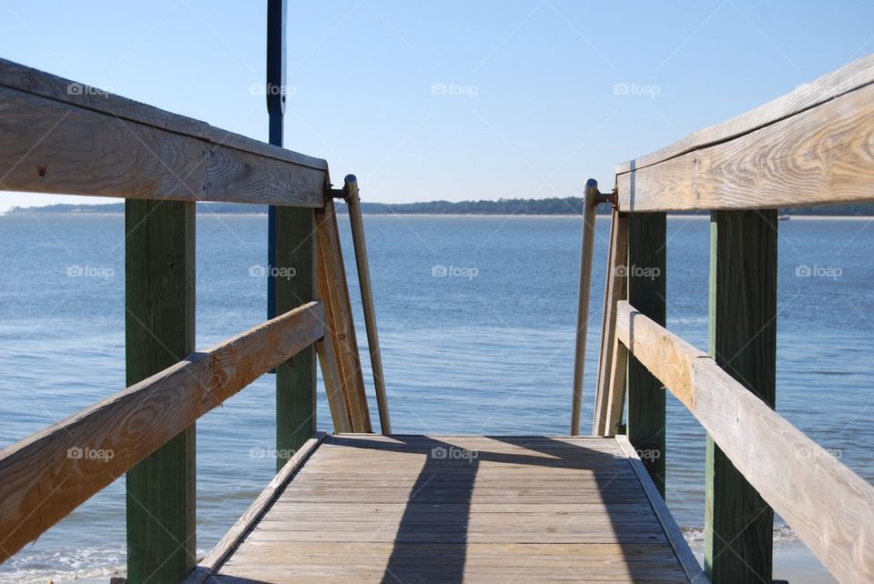 Pier over sea against sky