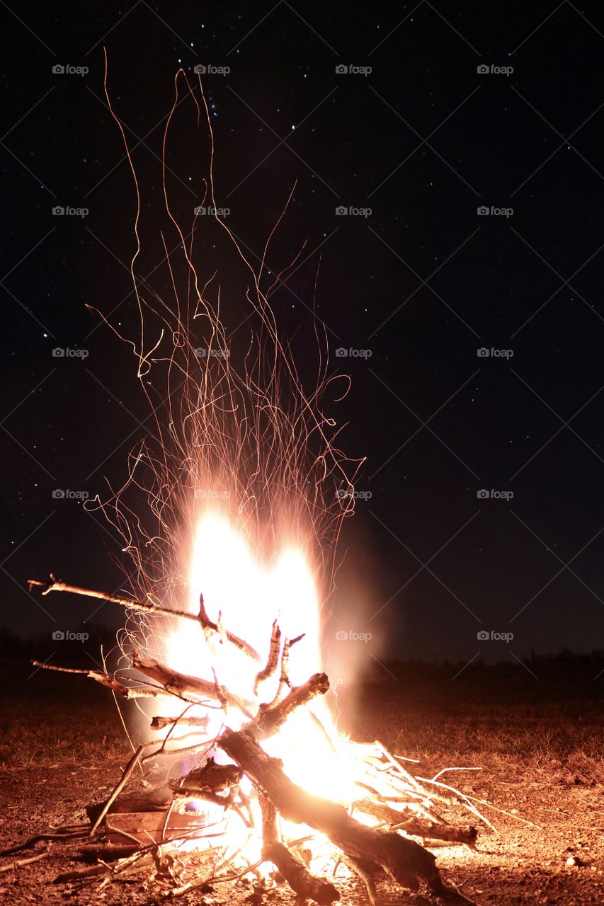 Fire glowing in the dark on a chilly autumn night.