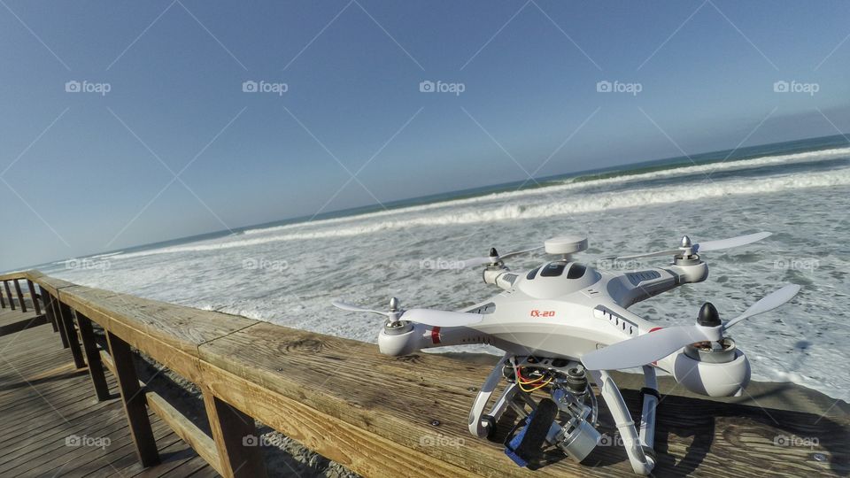 Drones, beach,  waves, photography and video.