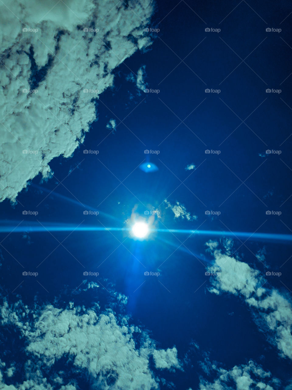 Blue sky & Sun lights Shot