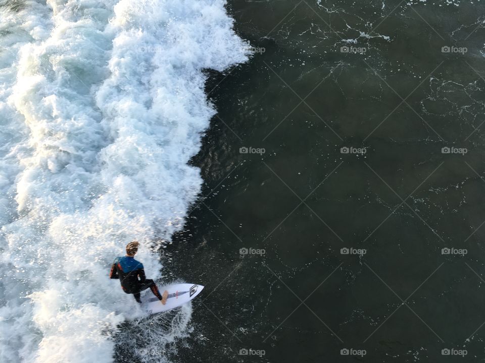 Surfer catches the wave