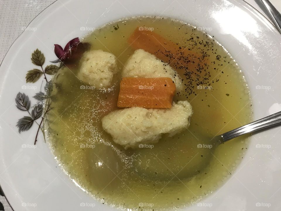 Homemade traditional soup with fresh vegetables and dumplings 