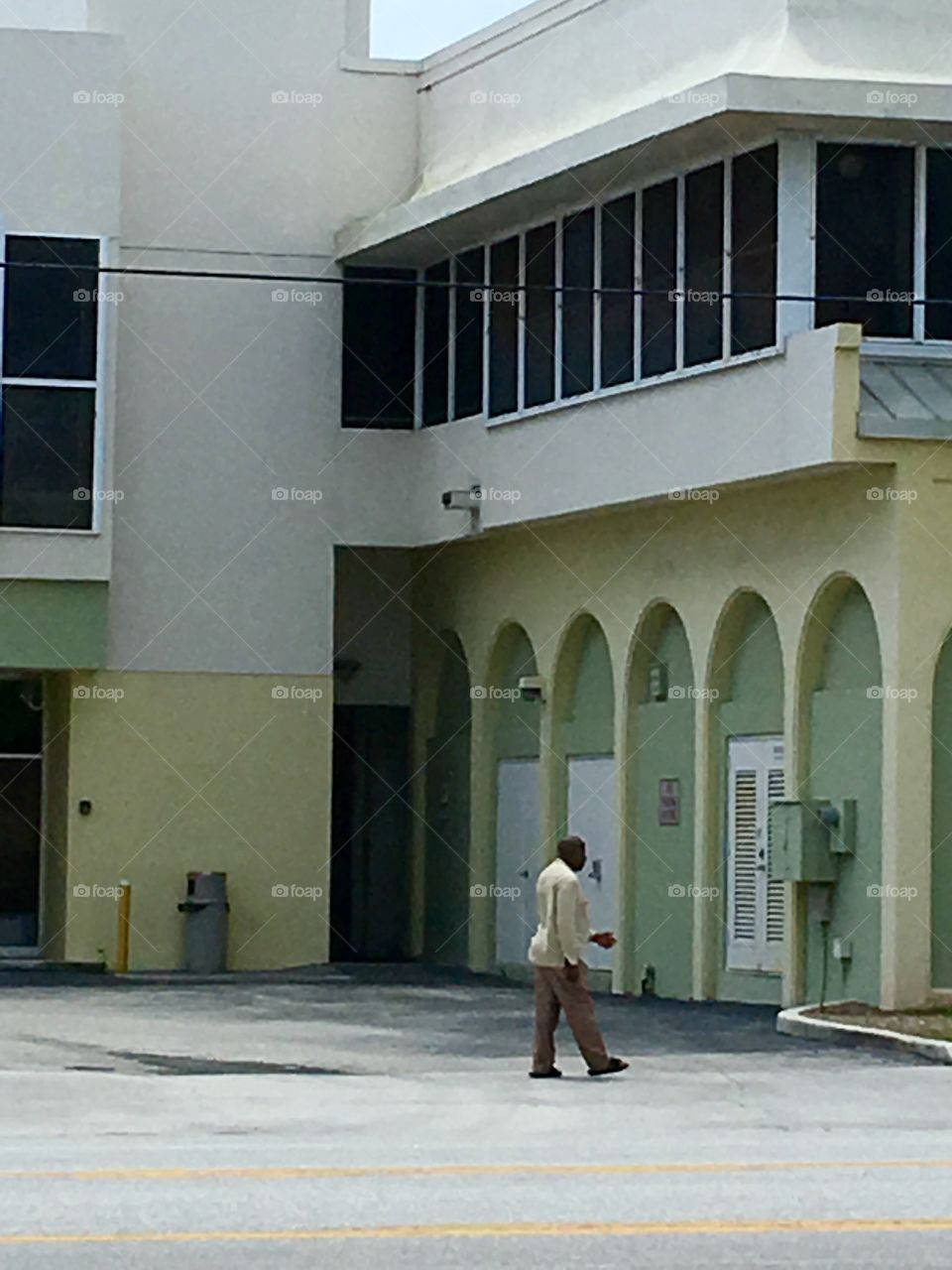 Man walking by deserted mall storefront!