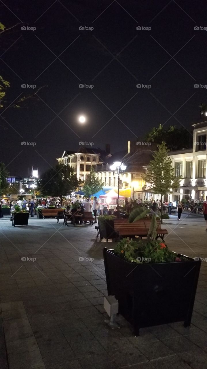 early morning #fullmoon #buildings #flower #matin #people #park #street #public #busystreet