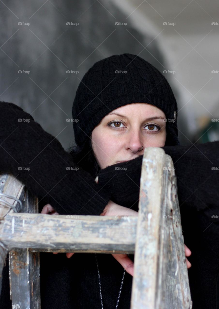 Portrait of a woman on a ladder, close up