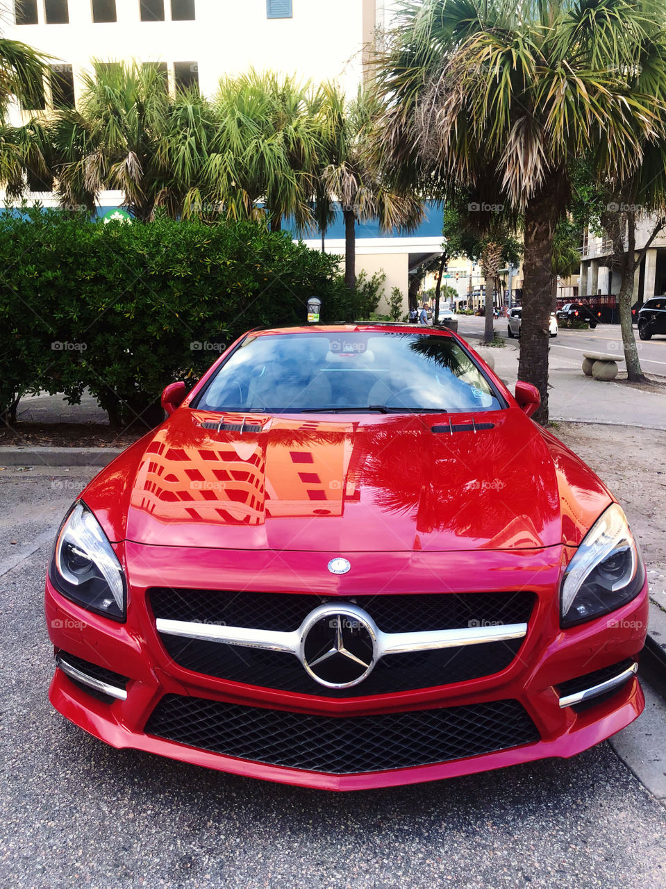 A beautiful red Mercedes Benz. 