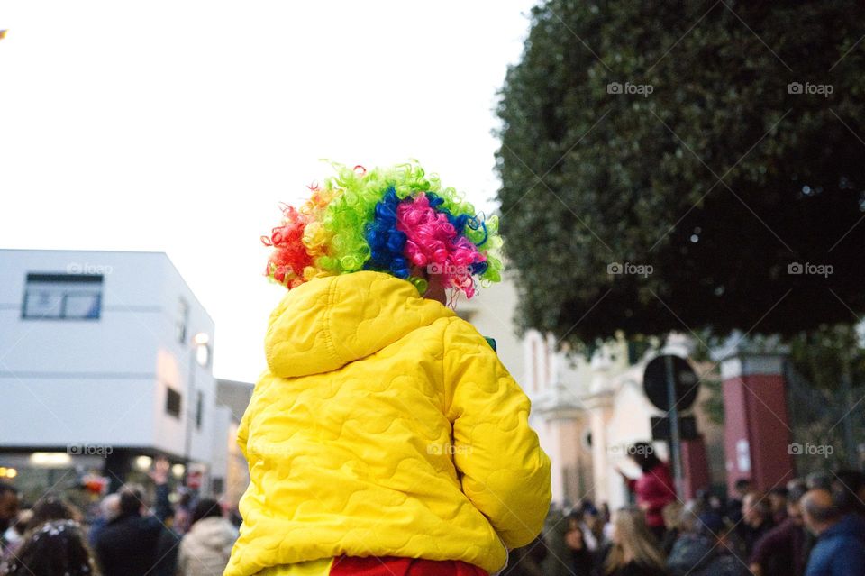 child with colored wig