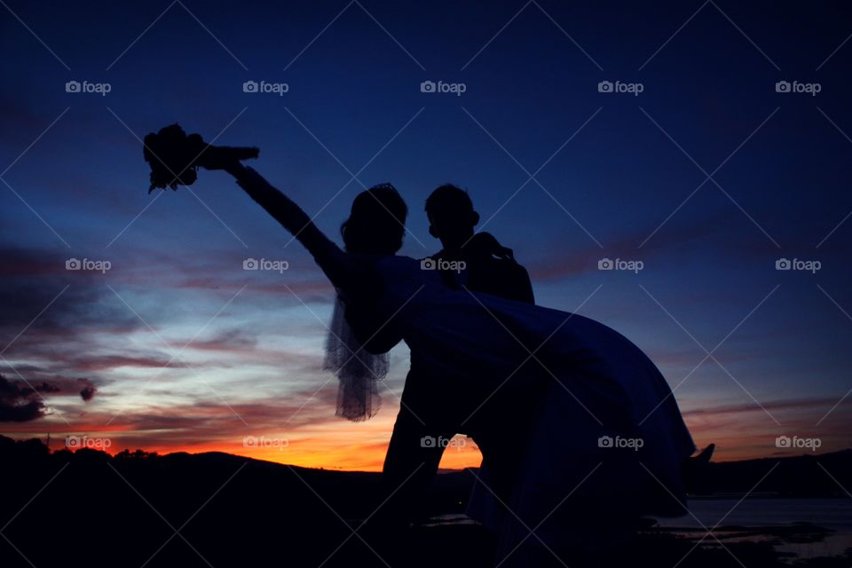 Wedding silhouettes of bride and groom.