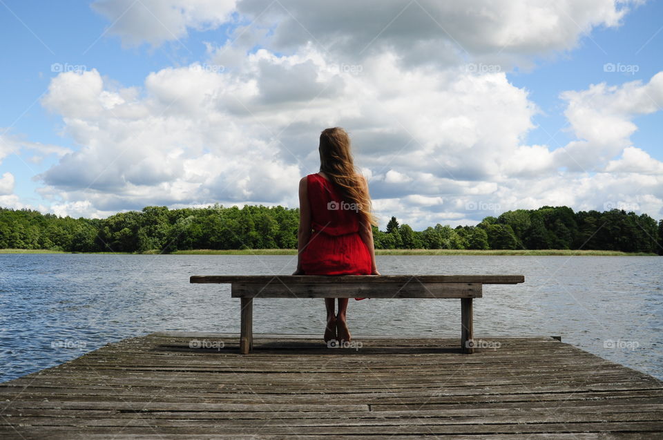 Girl in red at the lake 