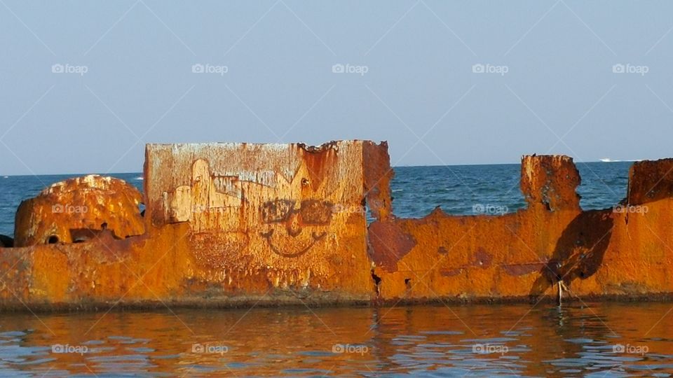Last smile of a sinking ship. Black sea beach