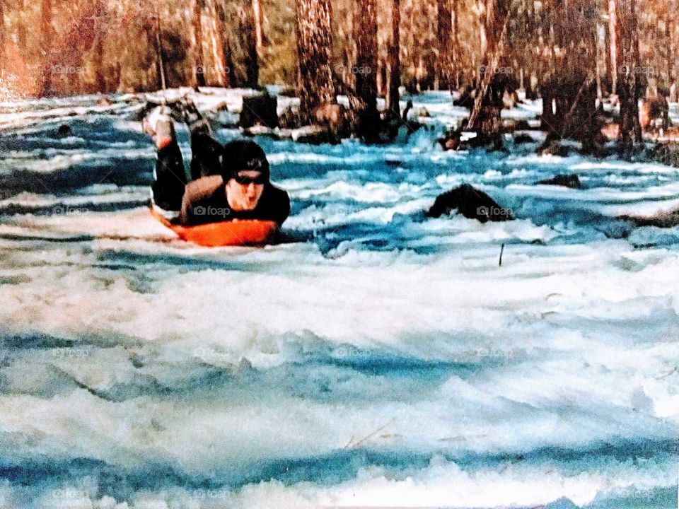 Dodging trees and rocks tobogganing in N. AZ. snowfall