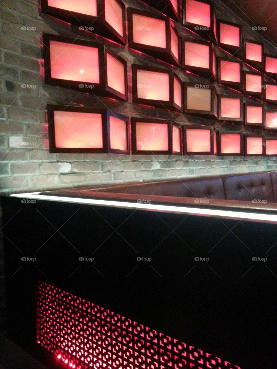 Red lights on a brick wall in a restaurant