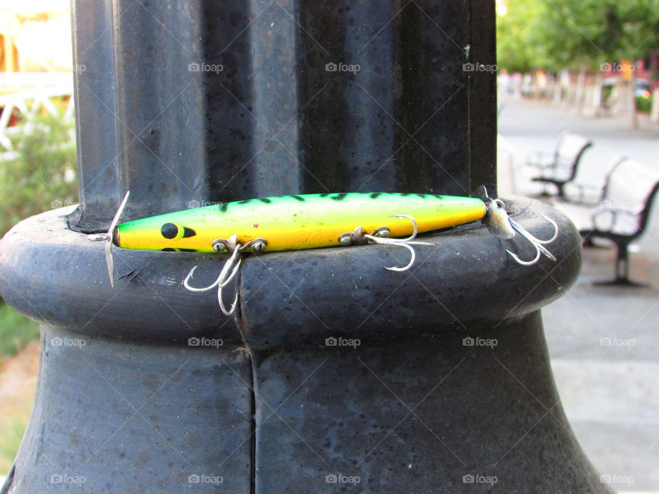 fishing hooks sitting on a post