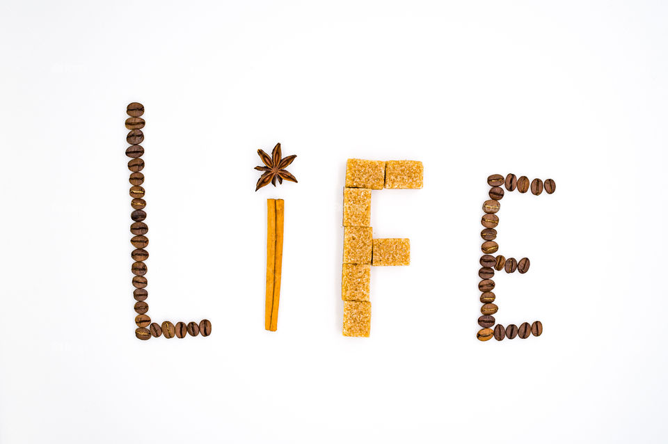The inscription "life" collected from coffee beans, cinnamon sticks, star anise and cane sugar
