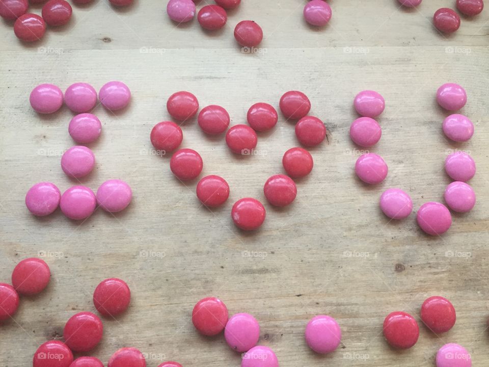 Pink and red candies that say I love you for Valentine's Day 