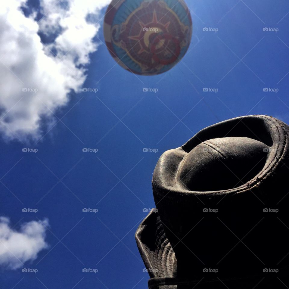 Eyes up. A person watching a hot air balloon 