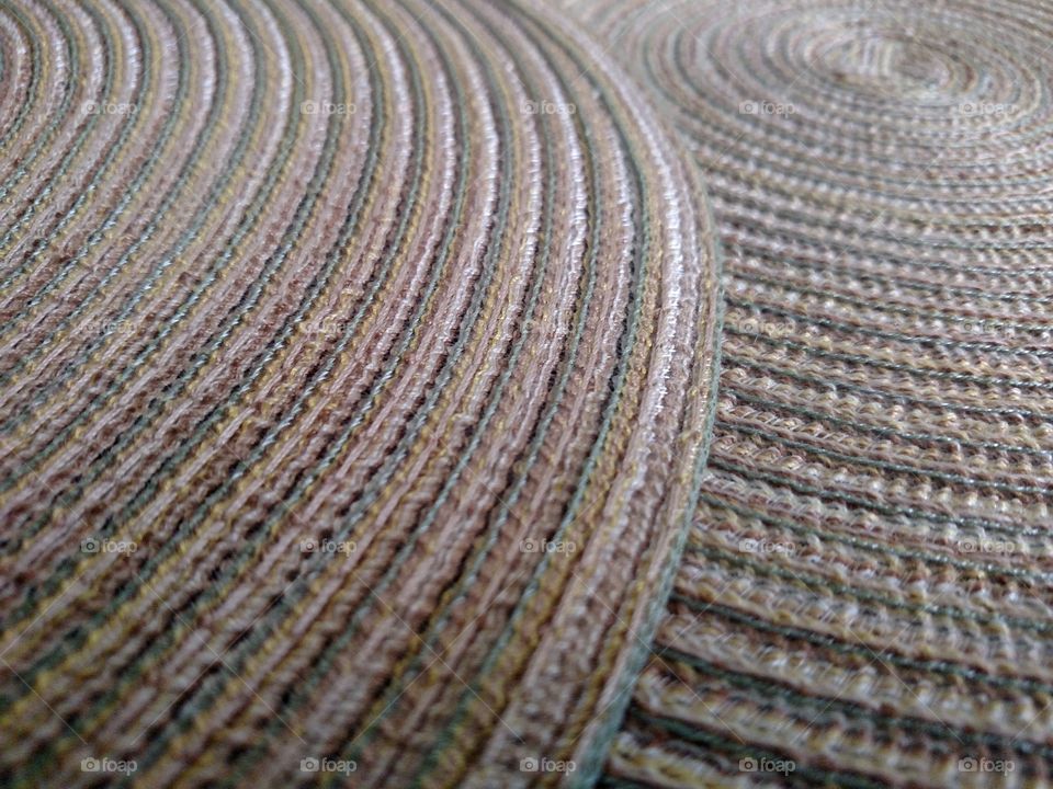 Close up of fabric circular mats.