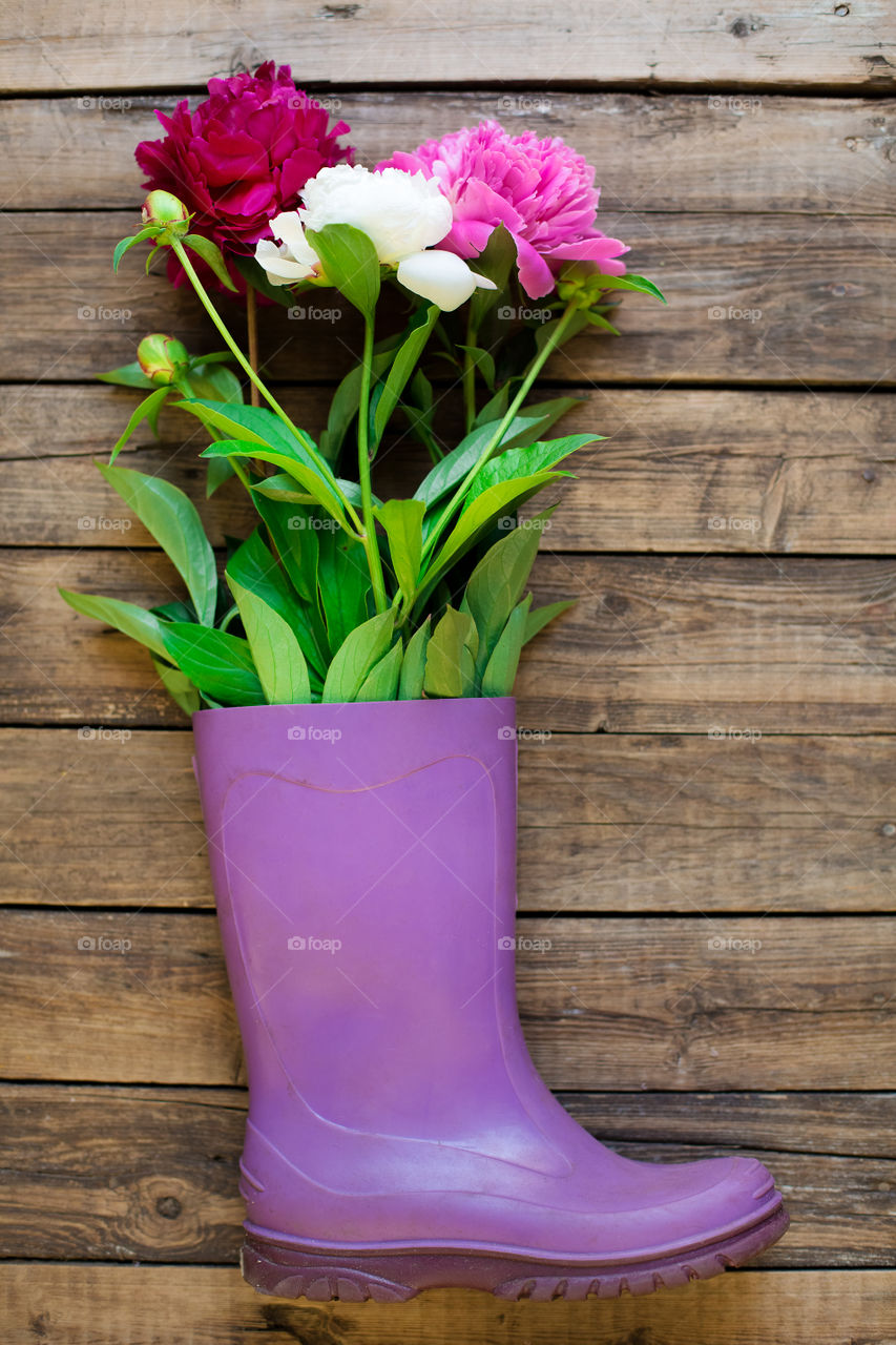 Flowers in the rubber boot