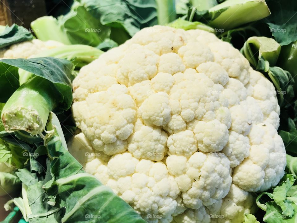 Fresh cauliflower in the market stand