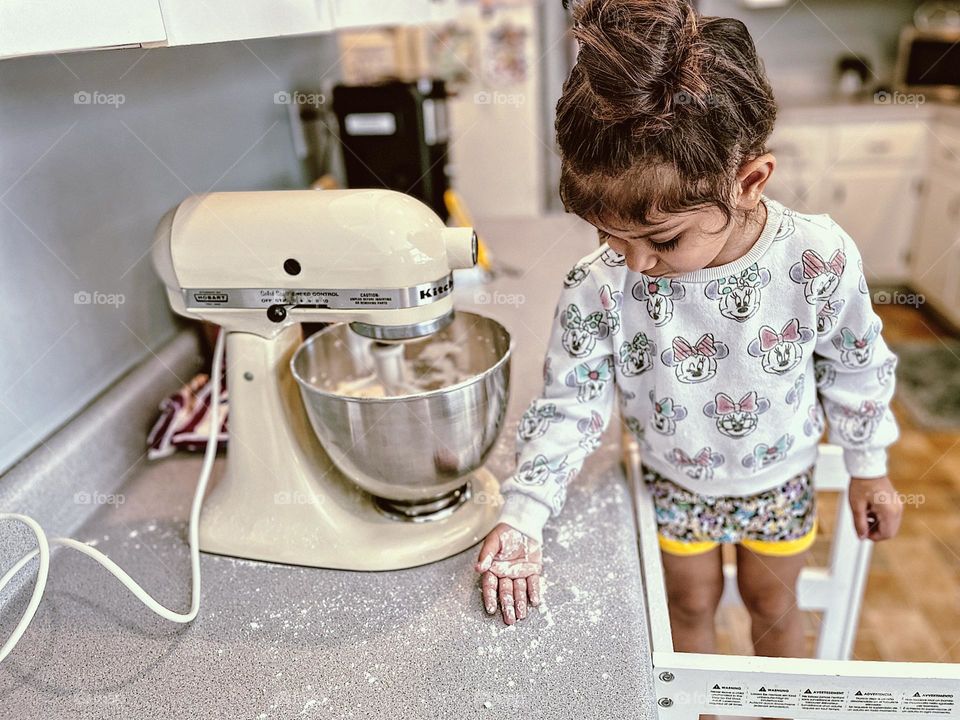 Toddler girl helps mommy in the kitchen, toddler covered in powdered sugar, toddler girl with KitchenAid mixer, toddler girl having fun in the kitchen